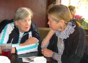Diane and her sister Patricia sit at a table and talk