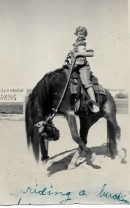Ten year old Diane poses on a fake bucking bronco